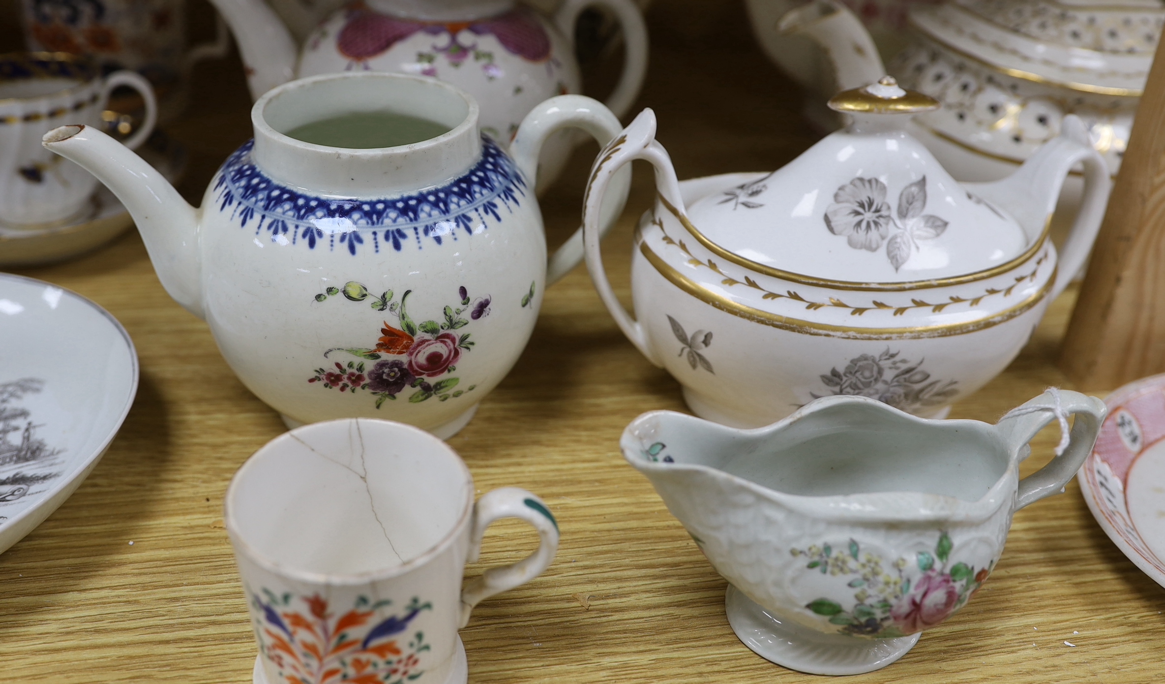 Collection of 18th century and Regency porcelain tea and coffee ware including teapots hand painted with flowers, cup and saucer with gilt decoration and a Philip Christian Liverpool sauceboat the largest 24cm wide